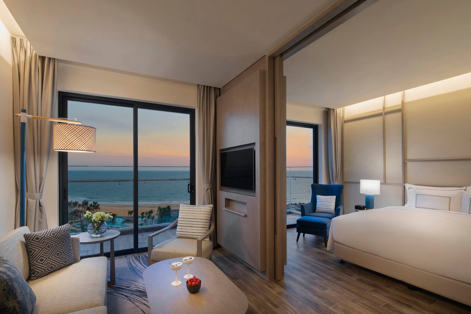 Interior view of the room with night area, day area, and balcony overlooking the beach at Melia Ho Tram