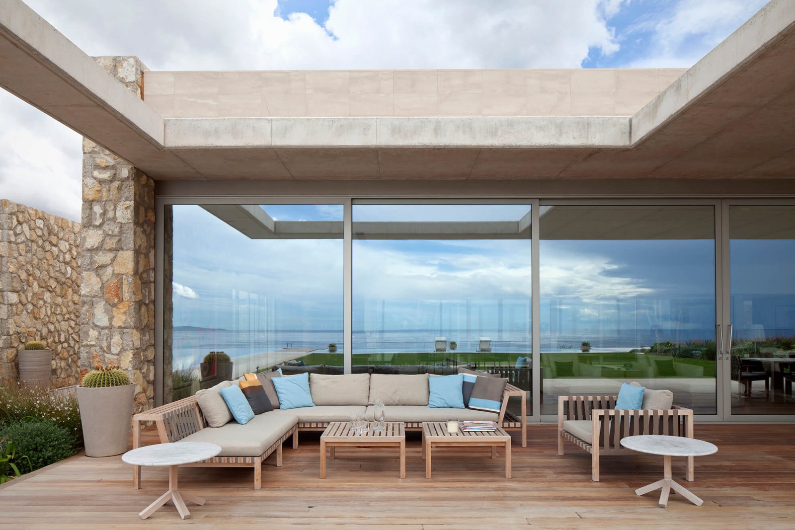 Another detail view of one of the covered chill-out areas, in front of large glass doors